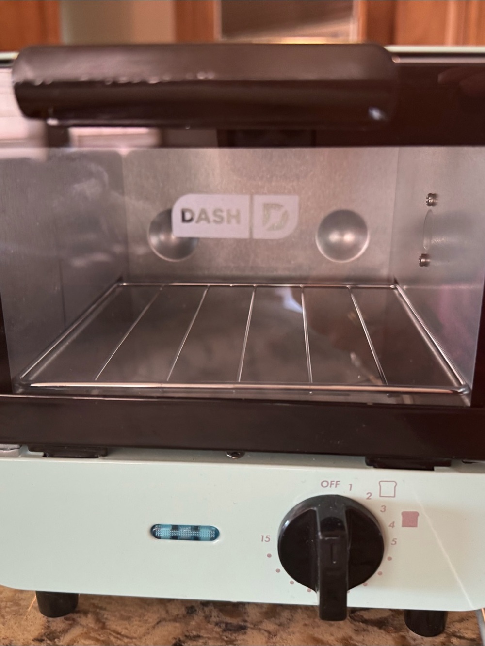 Dash Mint Green Countertop Toaster Oven like new.  Not used/scratches as noted